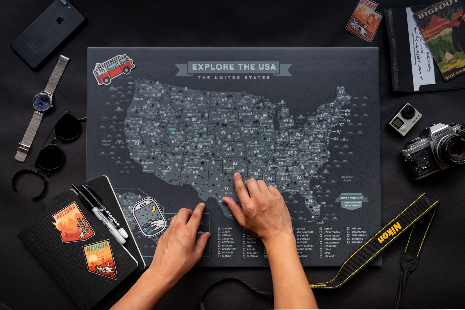 Hands on a United States travel map, planning which travel expo near me to visit